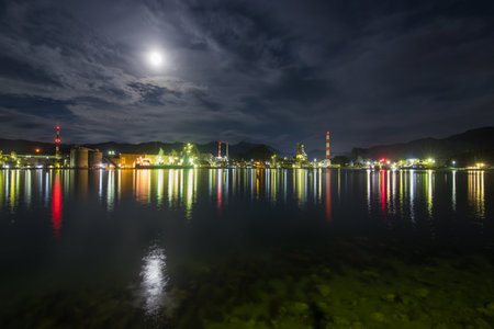 Factory night view and moonの写真素材