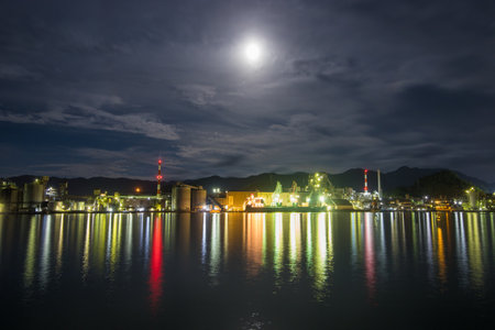 Factory night view and moonの写真素材