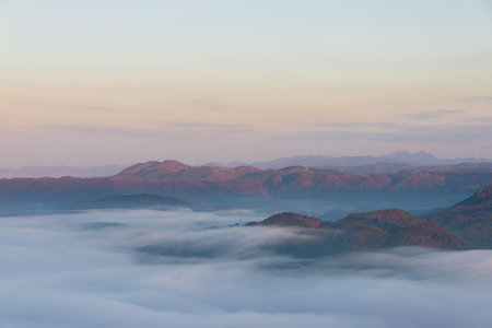 Mountain with fog in the morning at Doi Inthanon National Park, Chiang Mai, Thailandの写真素材
