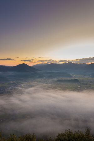 Sunrise over the foggy valley in Tuscany, Italyの写真素材
