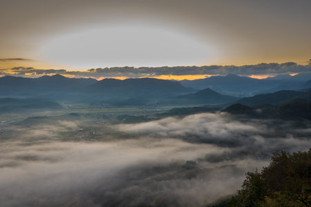 Sunrise over the mist in the morning at Phu Chi Fa, Chiang Rai, Thailandの写真素材