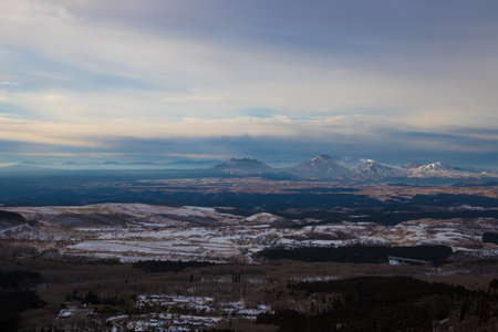 Beautiful winter landscape with snow-capped mountains in the backgroundの写真素材
