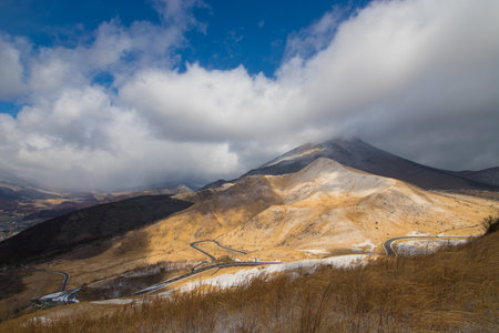 Winter landscape with snow covered trees and blue sky with sun rays.の写真素材