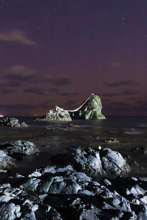 Beautiful night view of the starry sky over the sea.の写真素材