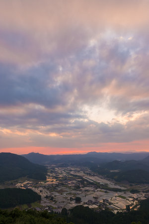 Sunset and rice fields from the summitの写真素材