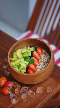 photo of avocado smoothie bowl with strawberry toppingsの写真素材