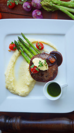 photo of colorful sirloin steak served on a plateの写真素材