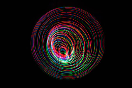 Abstract Light long exposure on dark background.の写真素材