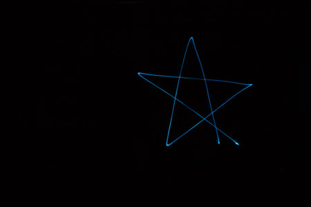 Long exposure small neon lights star  texture. Abstract colourfull neon light.の写真素材