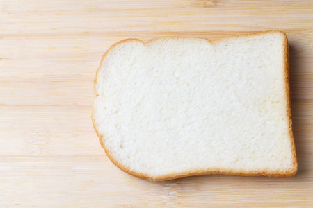 Slice of white bread isolated on white background.の写真素材