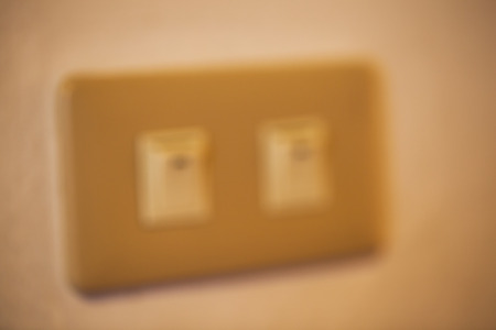 Abstract front device panel with detailed red power switch buttonの写真素材