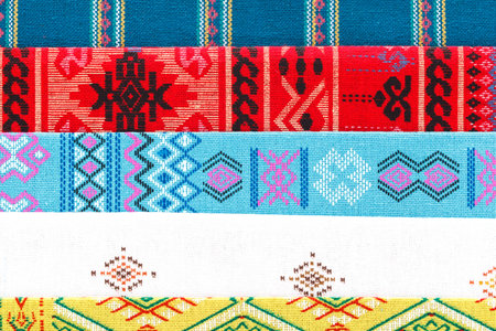 A collection of Thai silk. Colourful pattern of Thai silk . Thai style fabric background.の写真素材