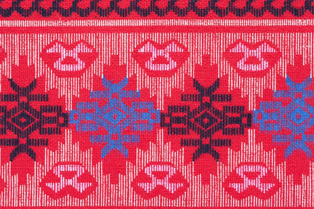 Colorful Thailand style rug surface close up vintage fabric is made of hand. Red Thai silk style...