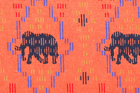 Colorful Thailand style rug surface close up vintage fabric is made of hand. Orange Thai silk style handmade.の写真素材