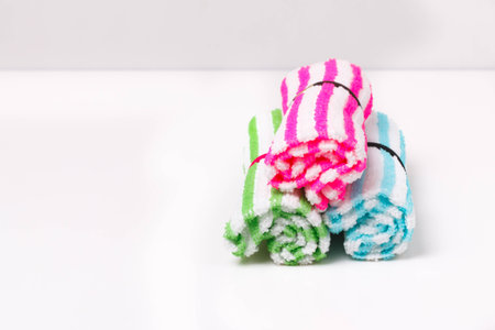Roll napkin fabric hand on background.の写真素材