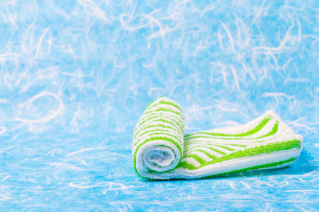 Roll napkin fabric hand on background.の写真素材