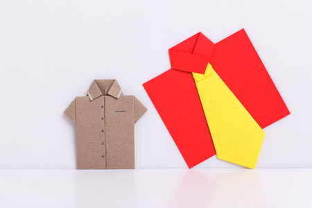 origami a man's shirt on a white background brown of paperの写真素材
