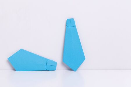 origami a man's shirt on a white background brown of paperの写真素材