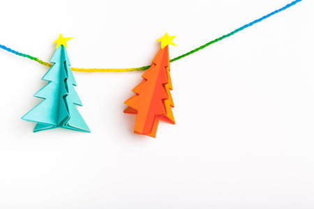 Christmas tree on white isolated origami.の写真素材