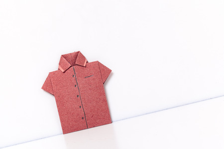 origami a man's shirt on a white background red of paperの写真素材