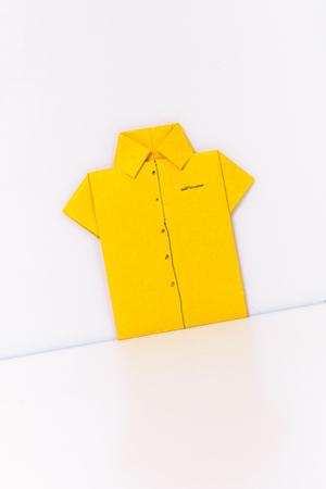 origami a man's shirt on a white background yellow of paperの写真素材