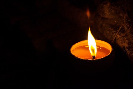 Still life candle light on old wall wiht Loy Krathong festival.の写真素材