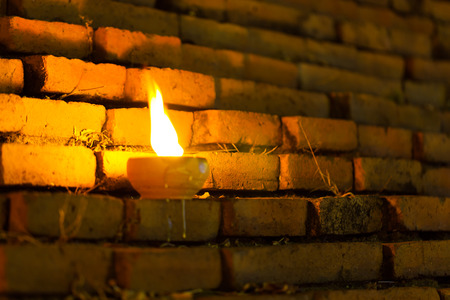 Still life candle light on old wall wiht Loy Krathong festival.の写真素材
