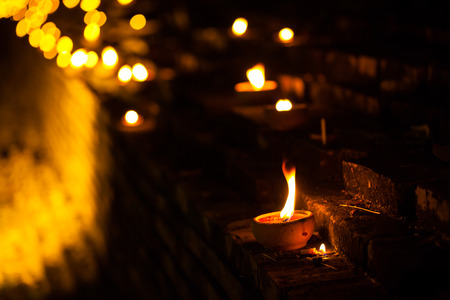 Still life candle light on old wall wiht Loy Krathong festival.の写真素材