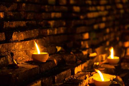Still life candle light on old wall wiht Loy Krathong festival.の写真素材