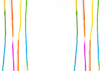 Multicolored rope on white background.の写真素材