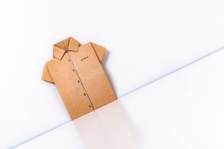 origami a man's shirt on a white background brown of paperの写真素材
