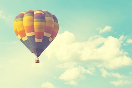 Hot air balloon on sun sky with cloud, vintage and retro  filter effect styleの写真素材