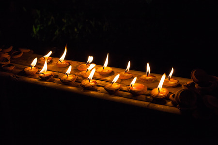 candle light on old wall with Loy Krathong festival.の写真素材