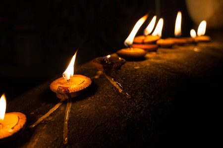 Still life candle light on old wall with Loy Krathong festival.の写真素材