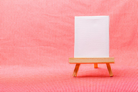 wooden easel with blank canvas.の写真素材