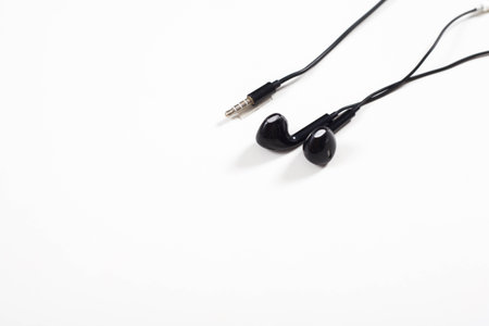 black earphone on white background.の写真素材