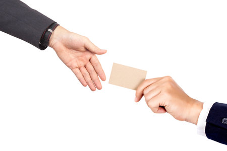 Hand hold blank plain kraft business card design mockup give to businessmanの写真素材