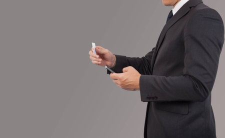 Businessman using mobile phone  credit card.の写真素材