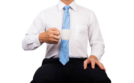 Business man hold white cup of coffee with white shirt. Cliping path.の写真素材