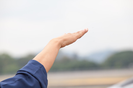 A man make pilot hand sign.