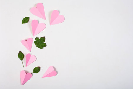 Pink paper heart on white box background.の写真素材