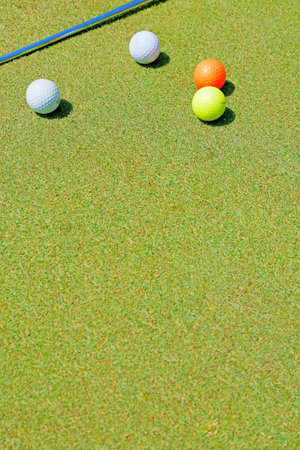 Lawn green with a golf ballの写真素材