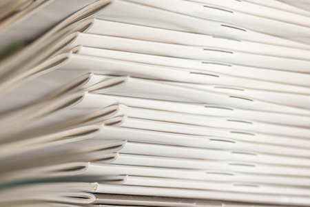 a book with a lot of white covers piled up