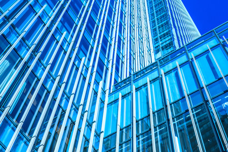 The blue sky and clouds reflected in the building