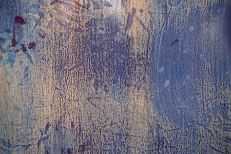 an old metal wall with painted stripped