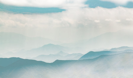 a mountain range in the cloudsの写真素材