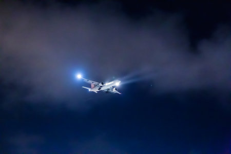 Airplane flying in the night sky