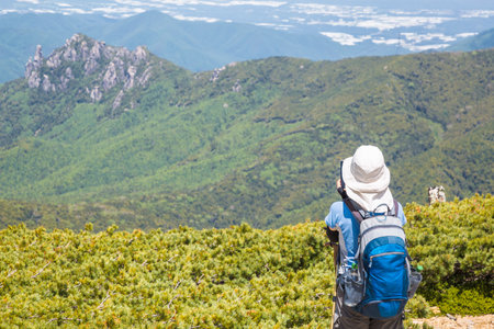 Fresh Green Mountain and Climbersの写真素材