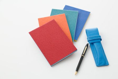 Colorful notepad and ballpoint penの写真素材