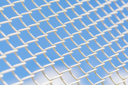 Blue sky and white fence